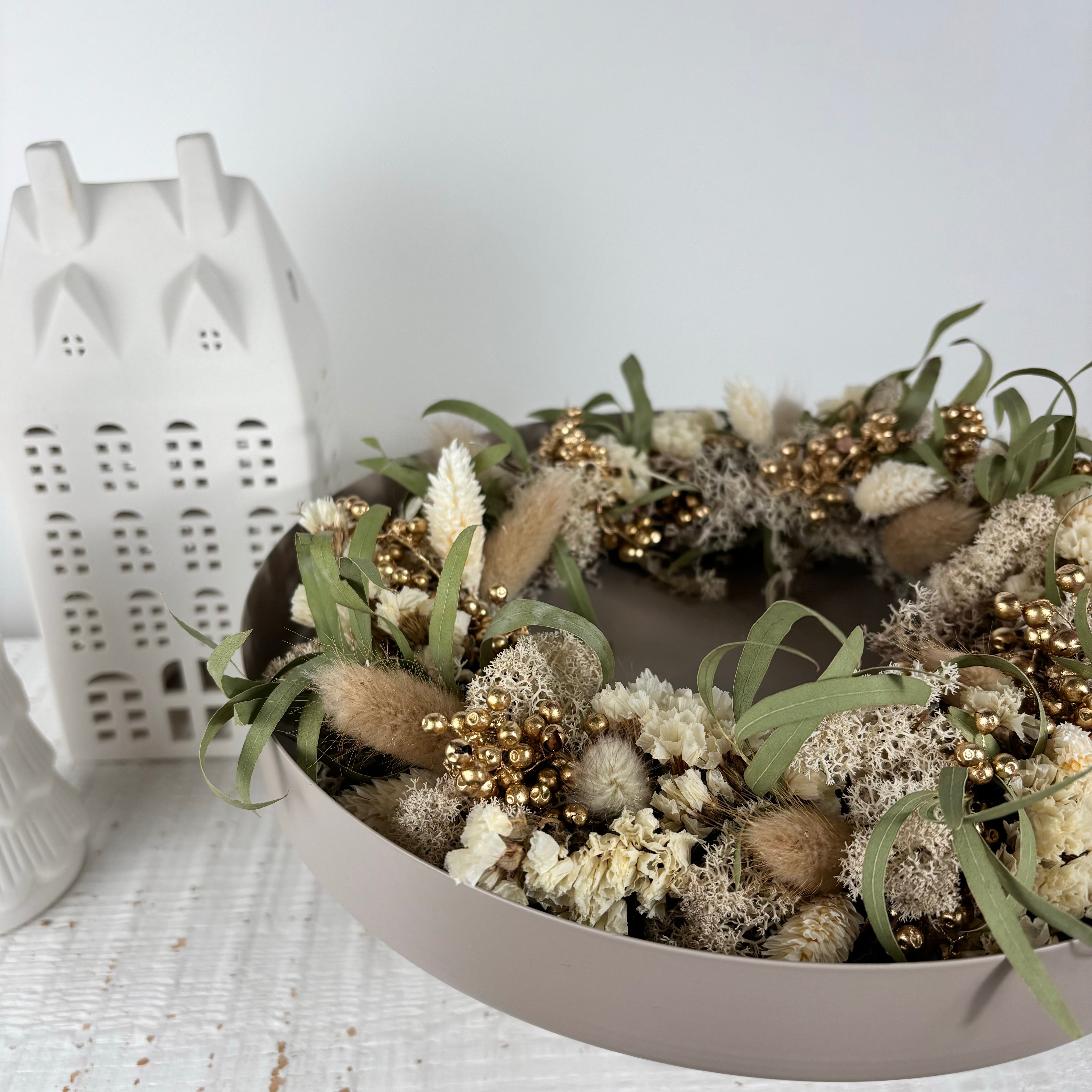 Winter wreath of dried flowers for candle tray