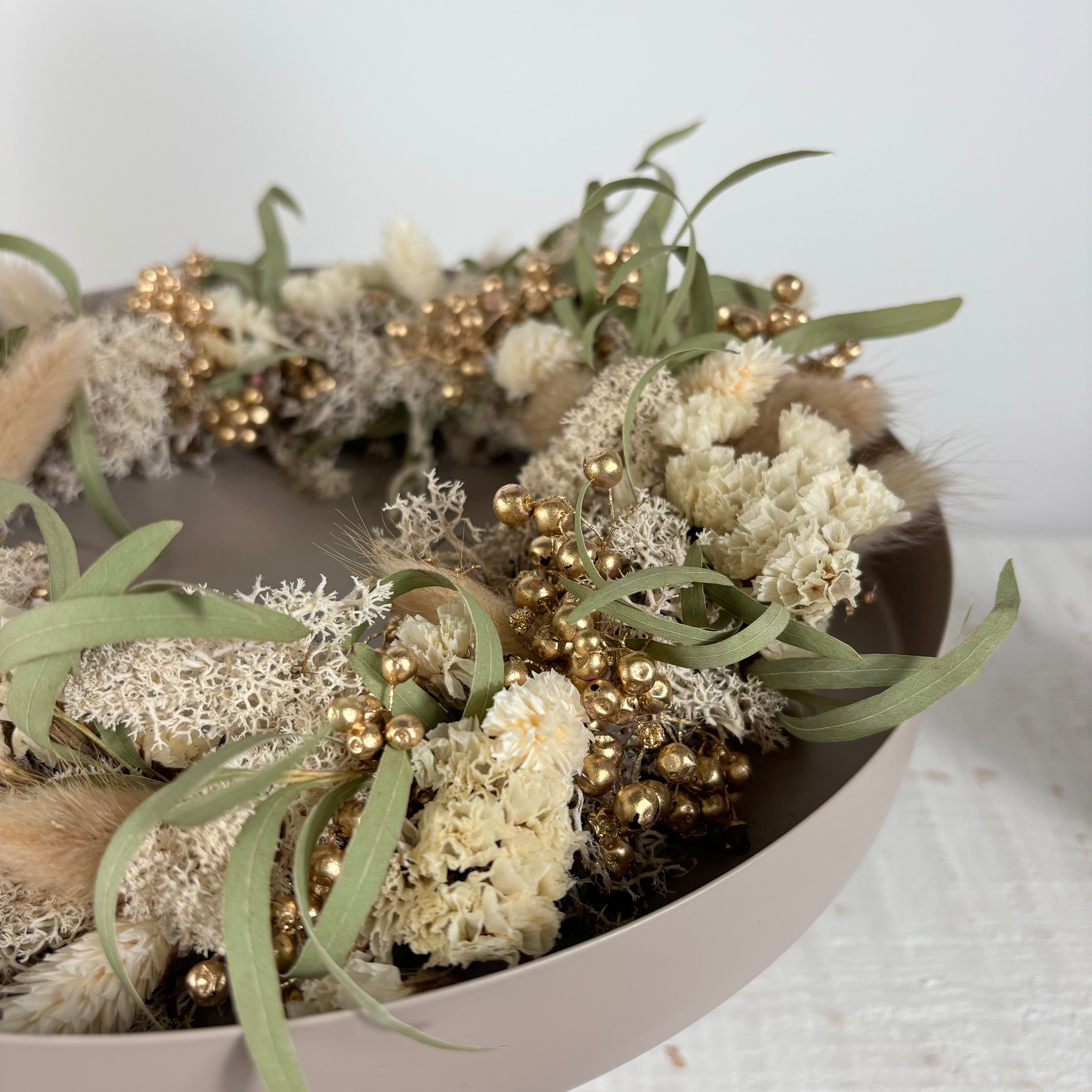 Winter wreath of dried flowers for candle tray