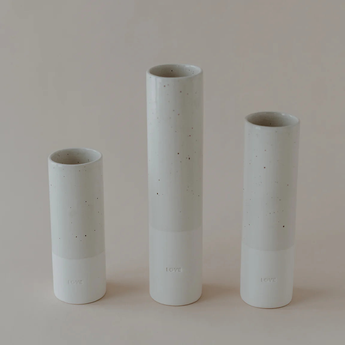 Stoneware vase in "love" | 5.5 cm x 19.5 cm | white