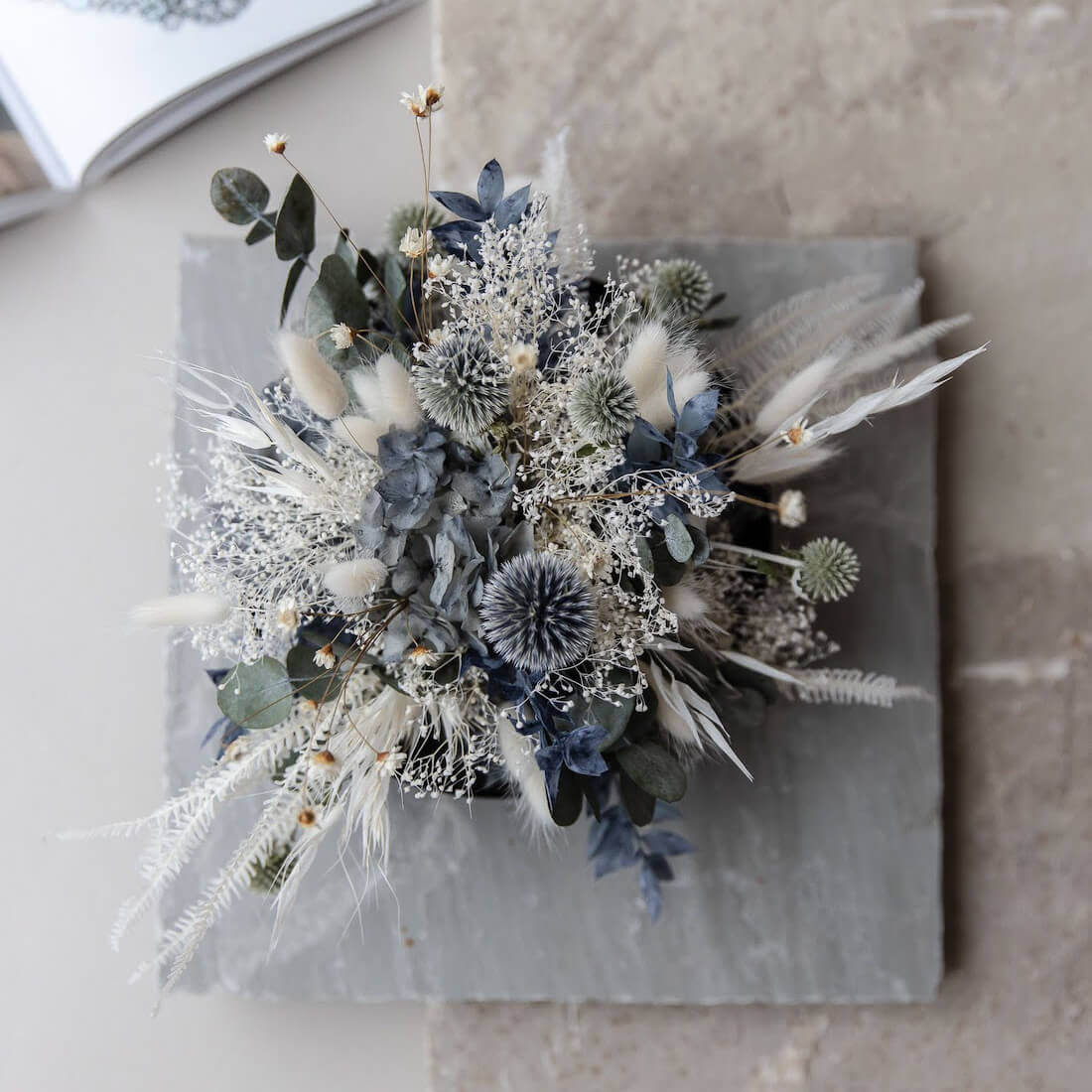 Elegance in blue and white: dried flower arrangement with eucalyptus