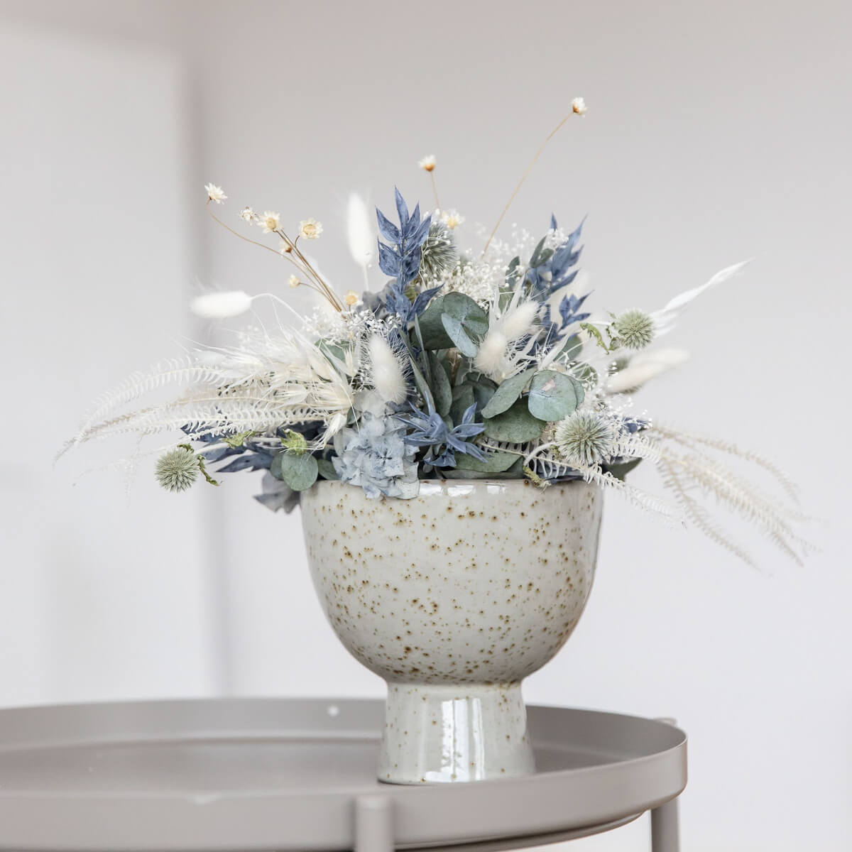 Elegance in blue and white: dried flower arrangement with eucalyptus