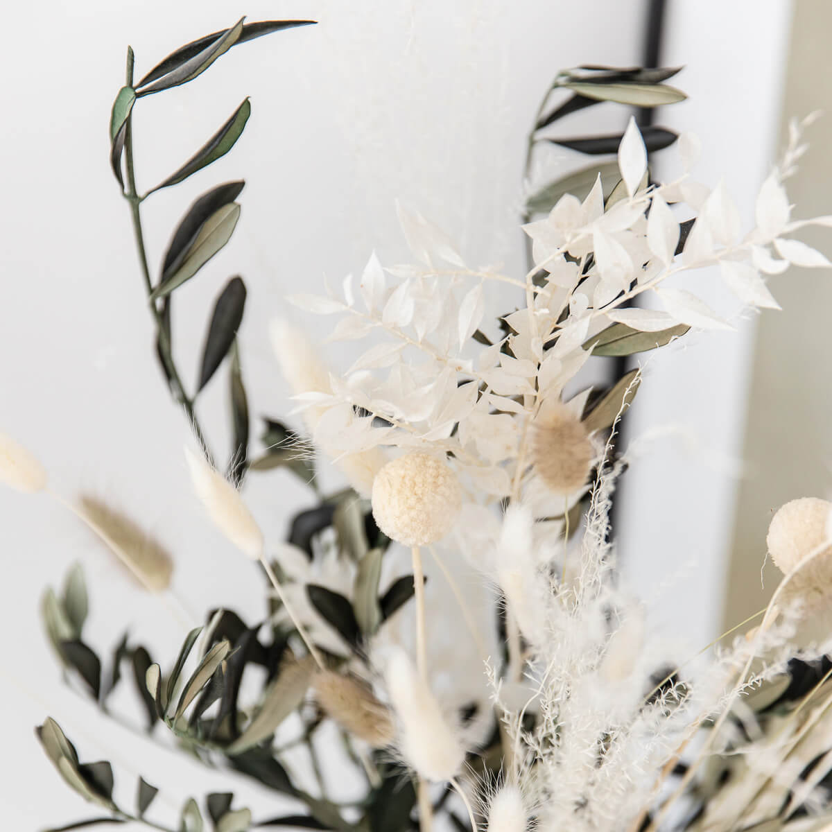 Perfect decoration: dried flower bouquet with olive branches in beige