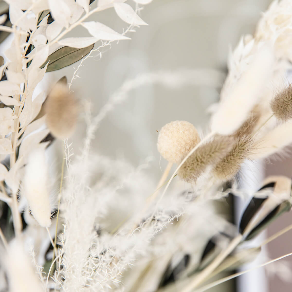 Perfect decoration: dried flower bouquet with olive branches in beige